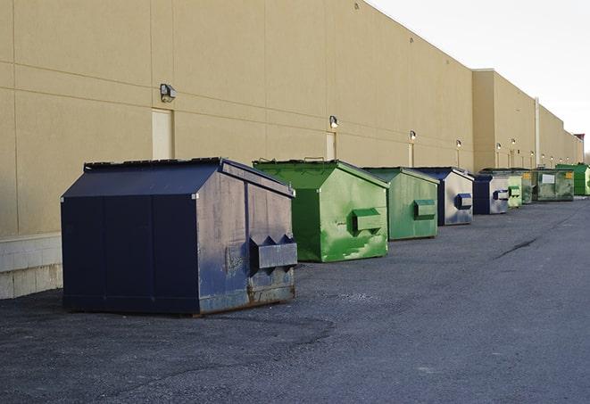 a stack of heavy construction dumpsters waiting to be emptied in Scotrun